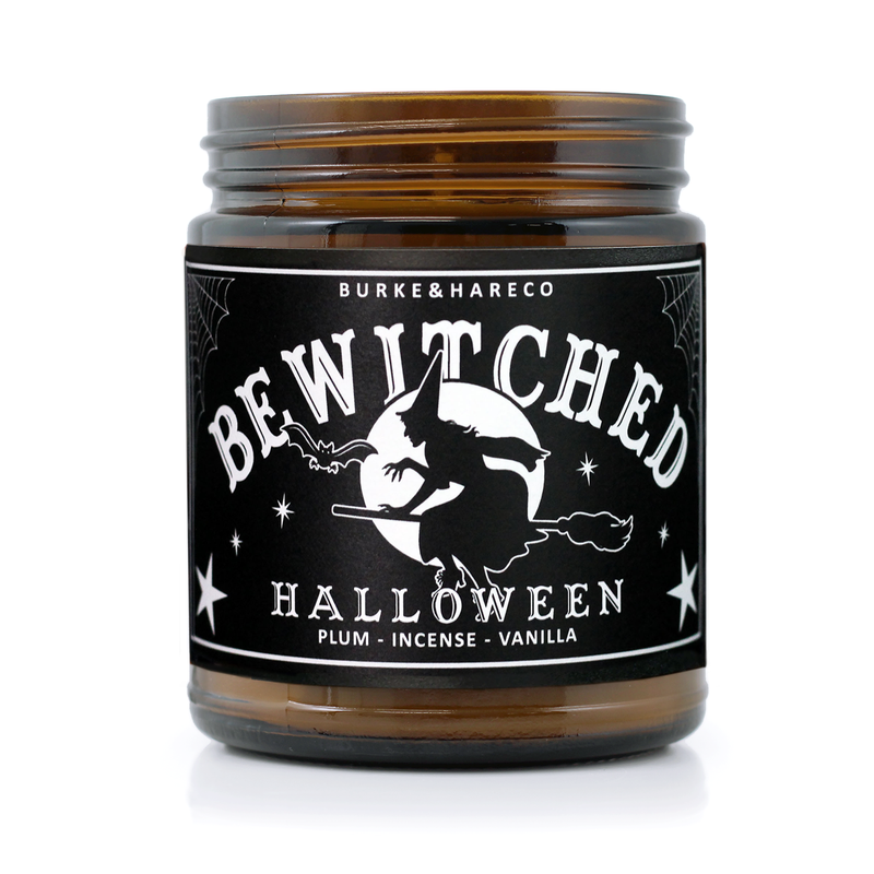 Witchy scented candle has a black label with a graphic witch against the moon on it and says 