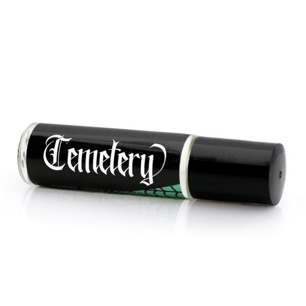 cemetery scented perfume for goths. minimal black label with white lettering that says "Cemetery".  fragrance notes on label are sweet grass, hay and dirt.