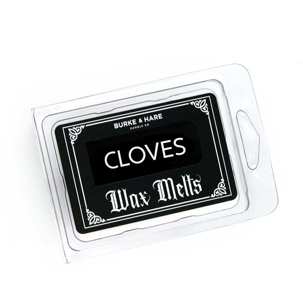Gothic wax melts in a clear clamshell container with black label that says Cloves in gothic font