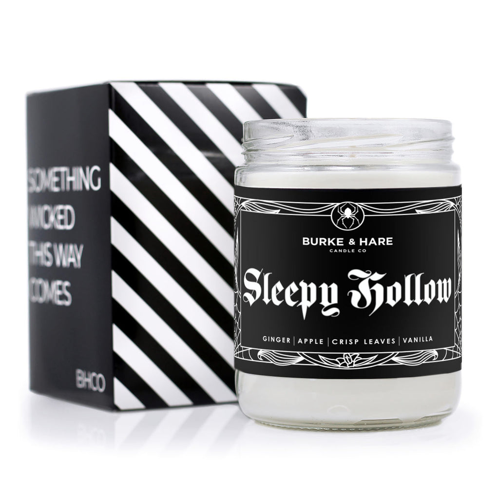 Full Size Halloween Scented Candle in clear jar with black label and white text that reads "Sleepy Hollow"