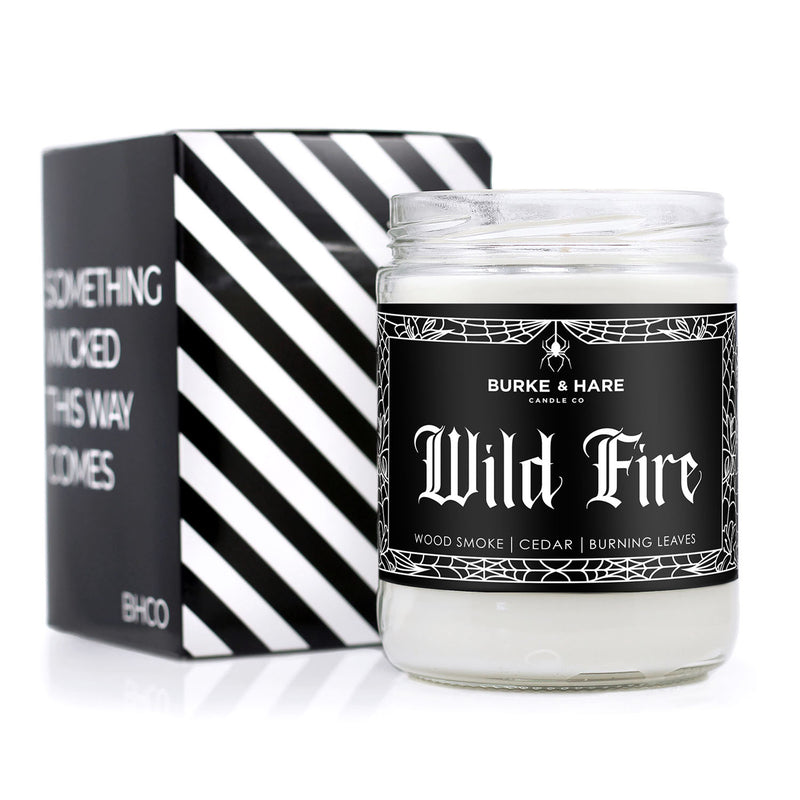 bonfire scented candle with black label and white gothic font that reads 