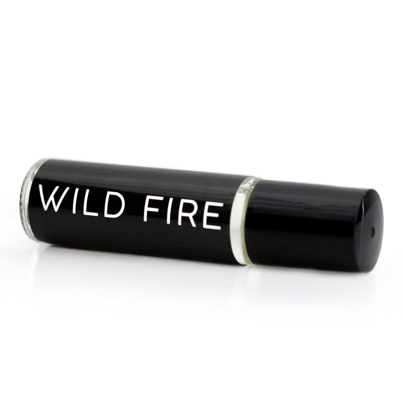 Bonfire scented perfume oil in a roll on vial with a black label and white text that says 