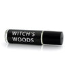 Gothic Perfume oil in a roller vial with a  black label and white text that says "Witch's Woods"