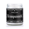 Krampus Inspired candle with a black label and gothic text that says "krampusnacht" with scent notes listed oatmeal, cinnamon and sandalwood in a clear jar.