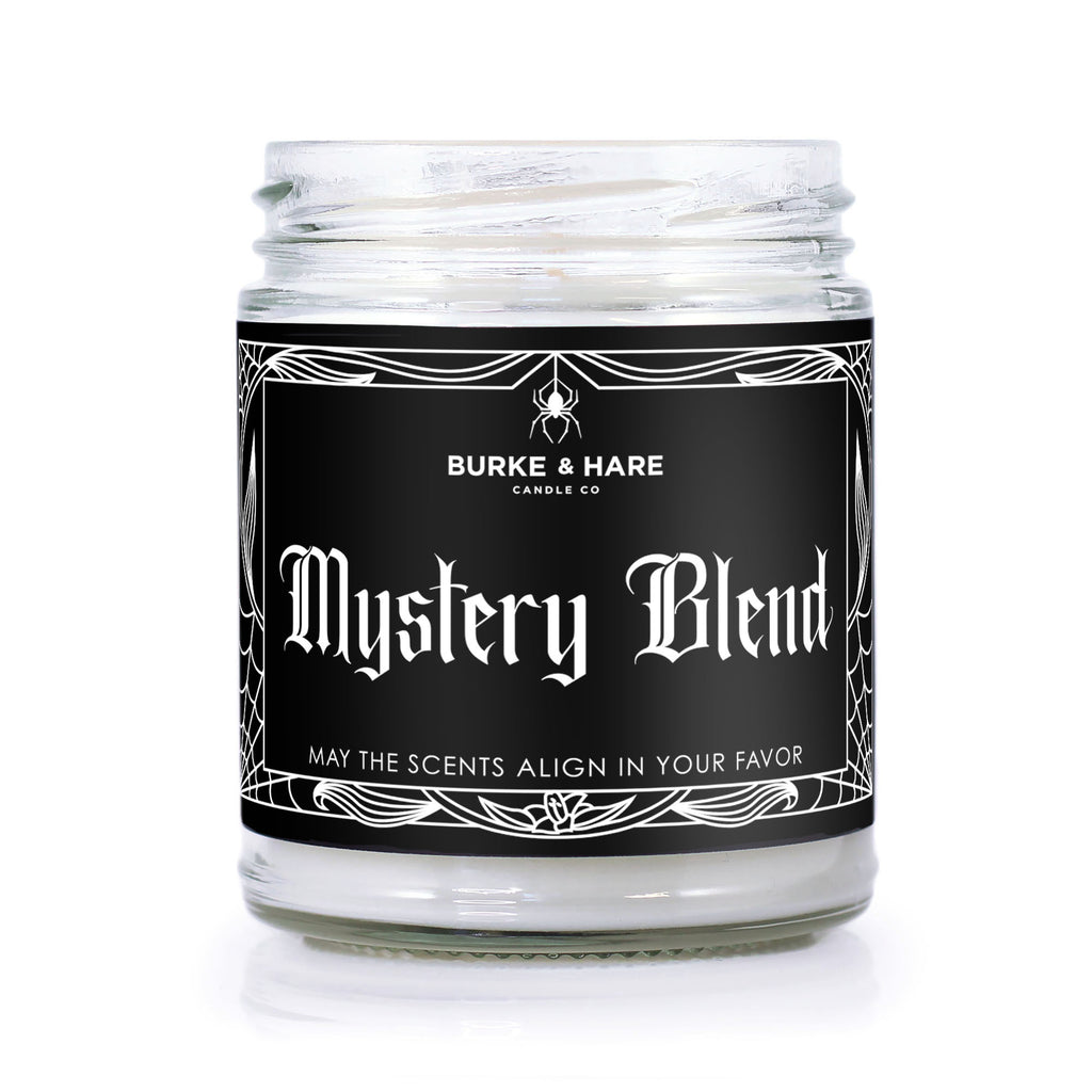 Scented candle with black label and white text