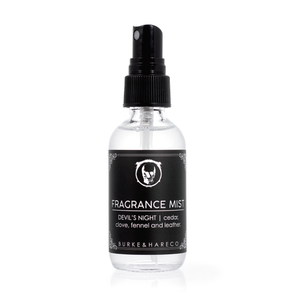 The Crow inspired fragrance mist in a glass bottle with black label that says Devil's Night in white font