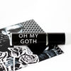 Oh My Goth perfume oil with black label and white text. 